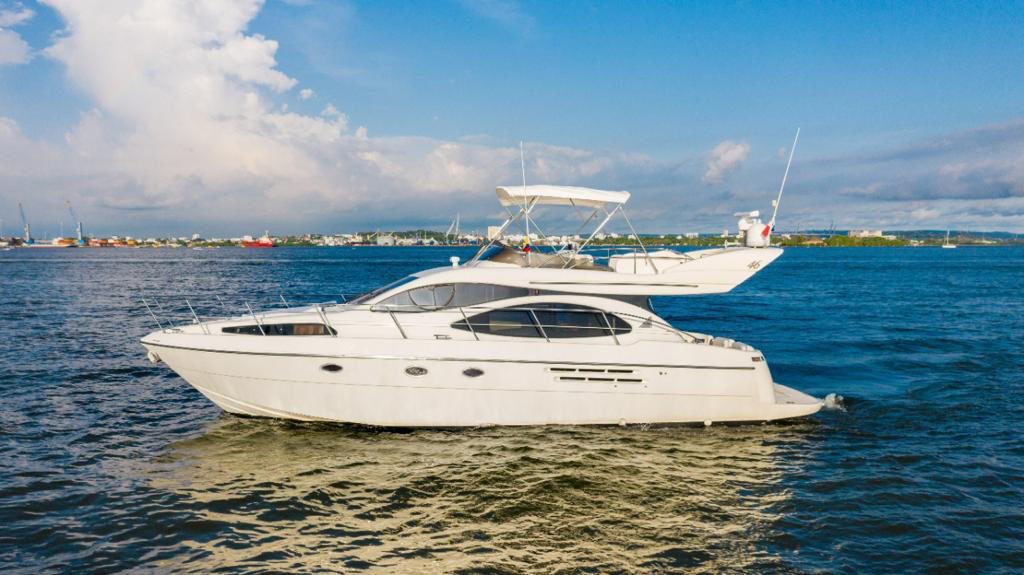 Guests jumping into the Caribbean Sea from the Azimut swim platform