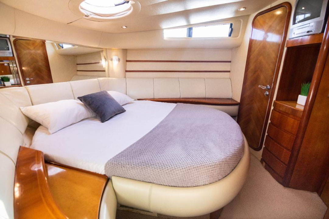 Guests jumping into the Caribbean Sea from the Azimut swim platform