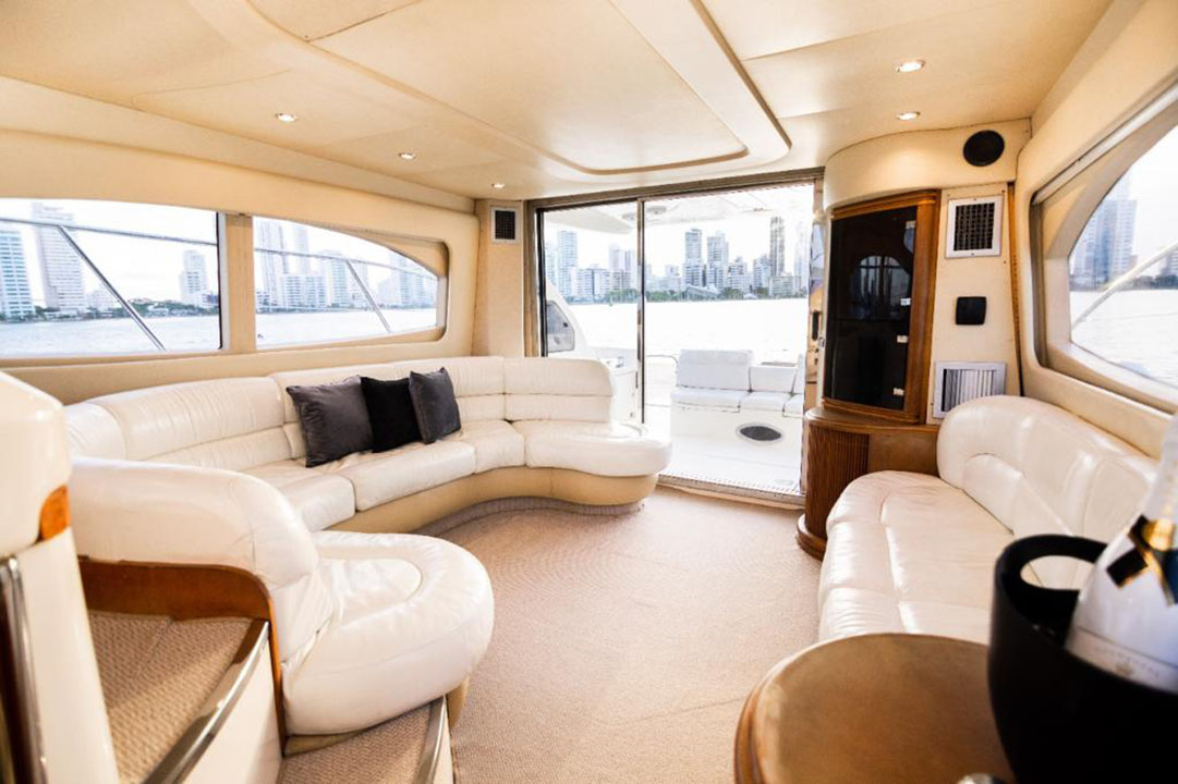 Group of friends enjoying drinks on the flybridge of the Azimut yacht