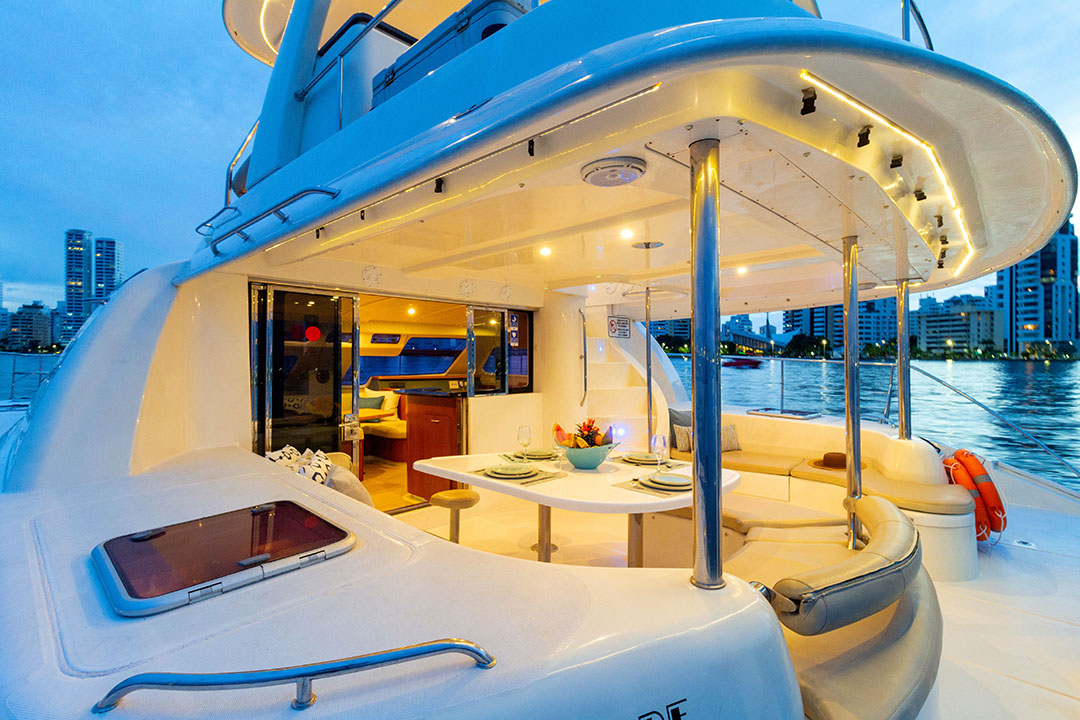 Guests dining on the aft deck of Hope at sea