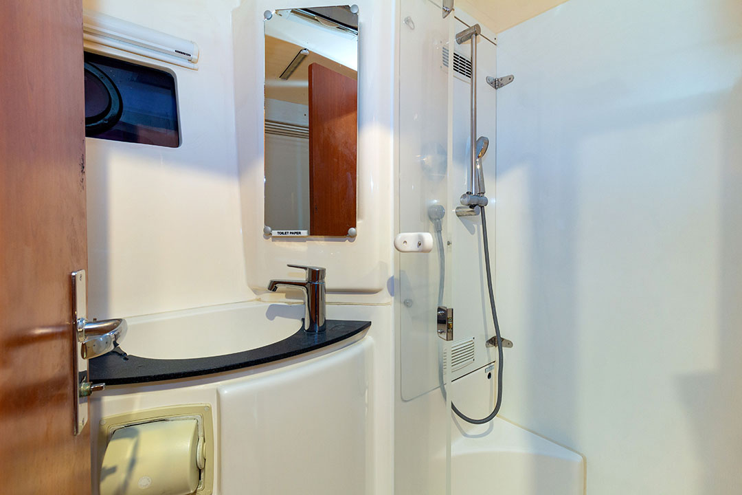 Hope’s flybridge featuring a shaded lounge and helm controls