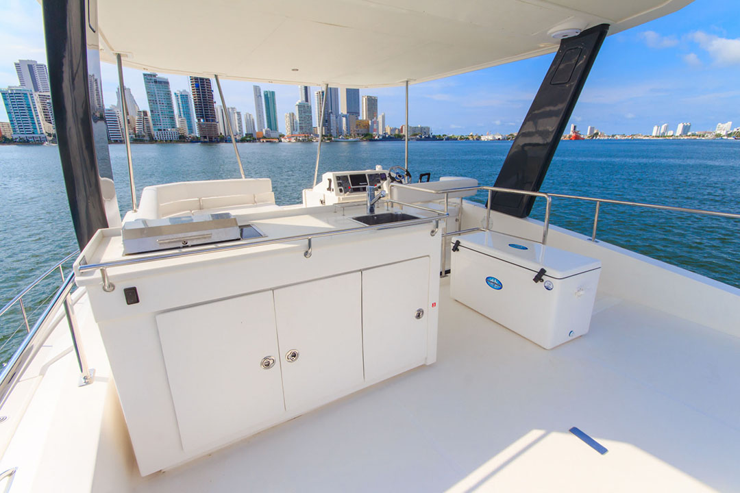 Oddy Sea anchored with guests snorkeling nearby in clear waters