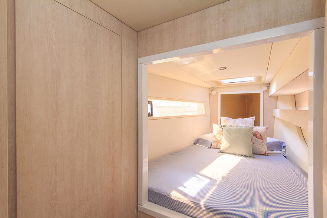 Side profile of the Oddy Sea catamaran sailing near the Rosario Islands