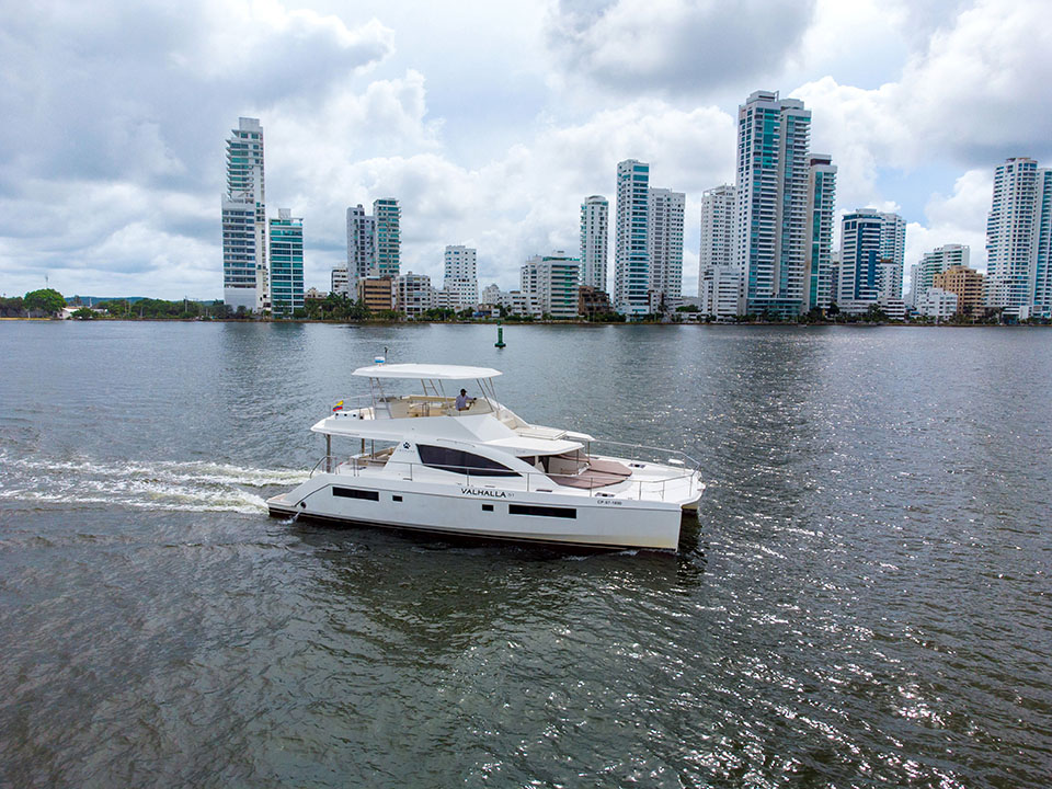Large catamaran anchored near a coral reef