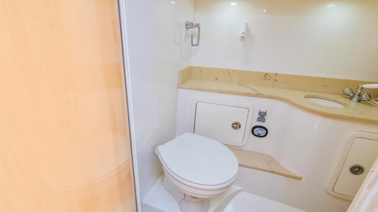 Mini yacht with four outboard motors docked in Cartagena.