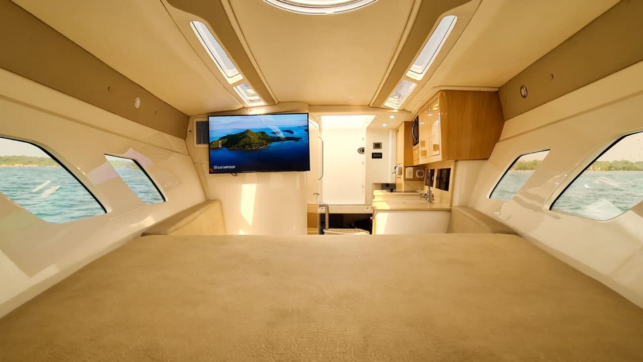 Aerial view of a small yacht with 4 motors in Cartagena.